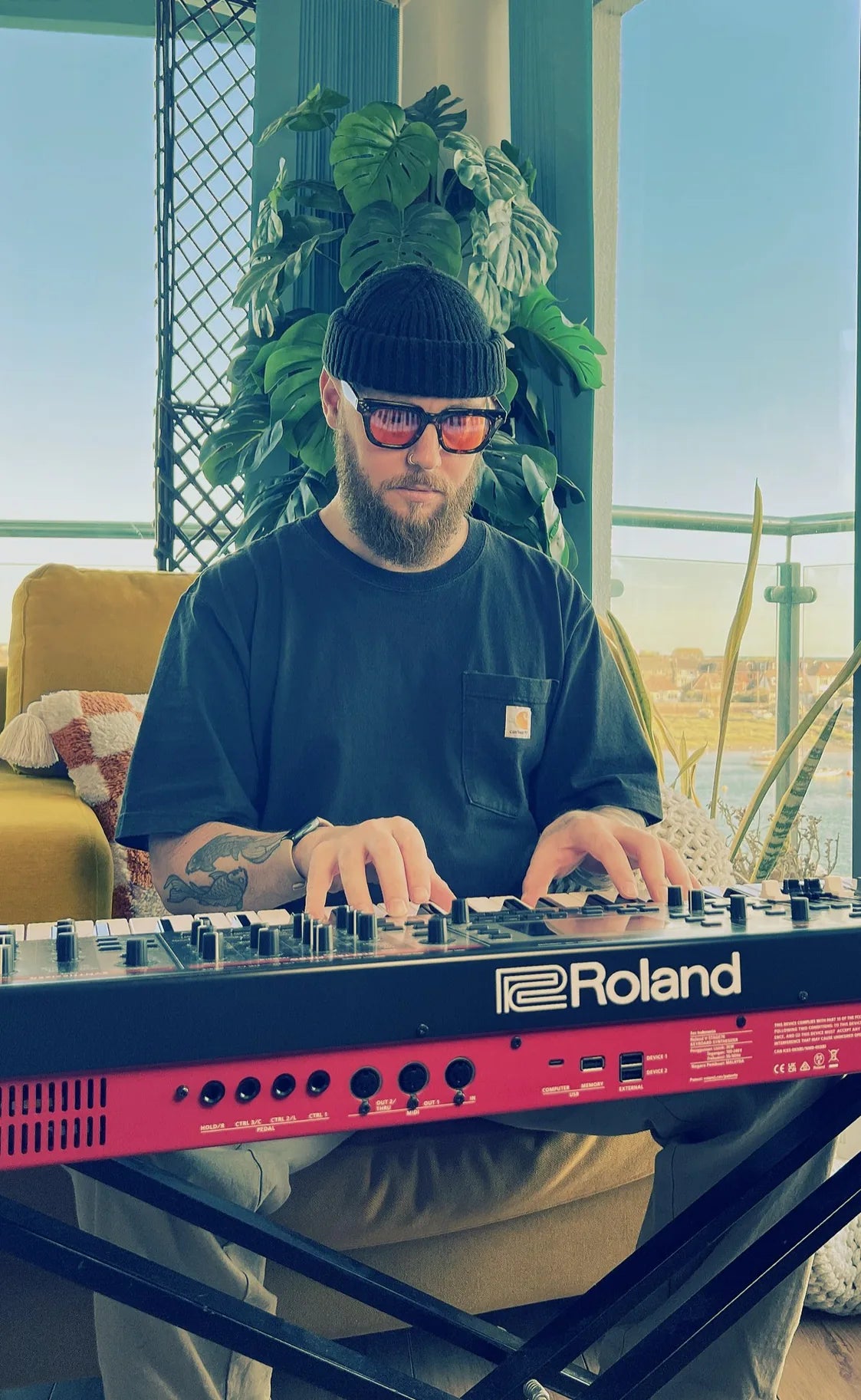 Oli Howe playing a Roland keyboard